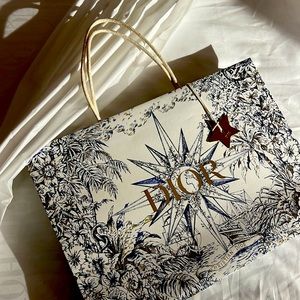 Dior bag, tissue paper and star charm